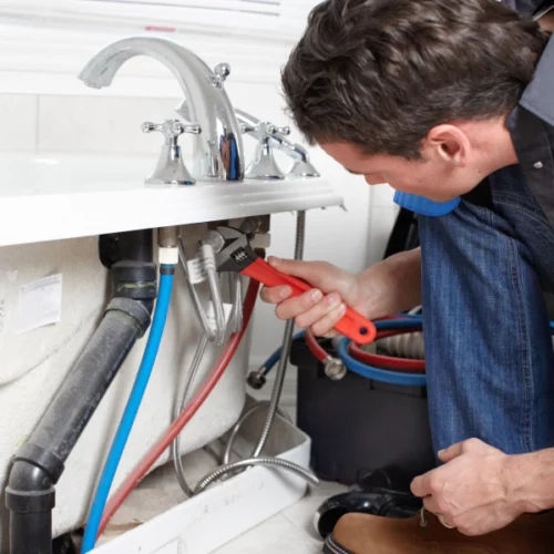 man-using-a-tool-to-repair-bathroom-sink-Hiram-GA-500x500